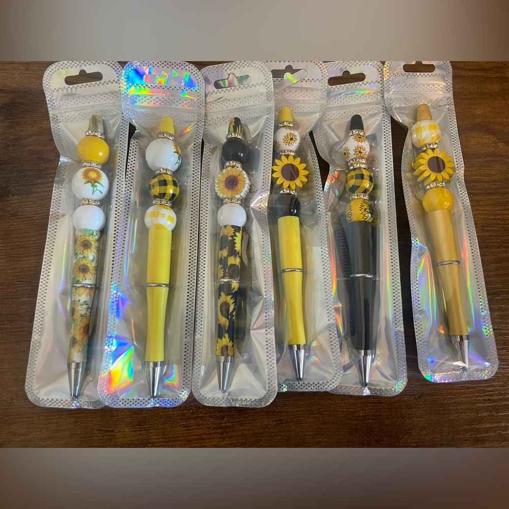 Hand beaded sunflower pens.